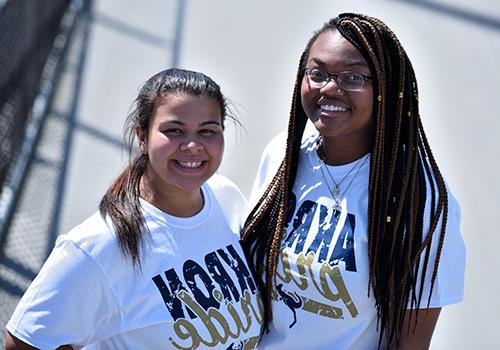 Two female students wearing Akron Pride t-shirts
